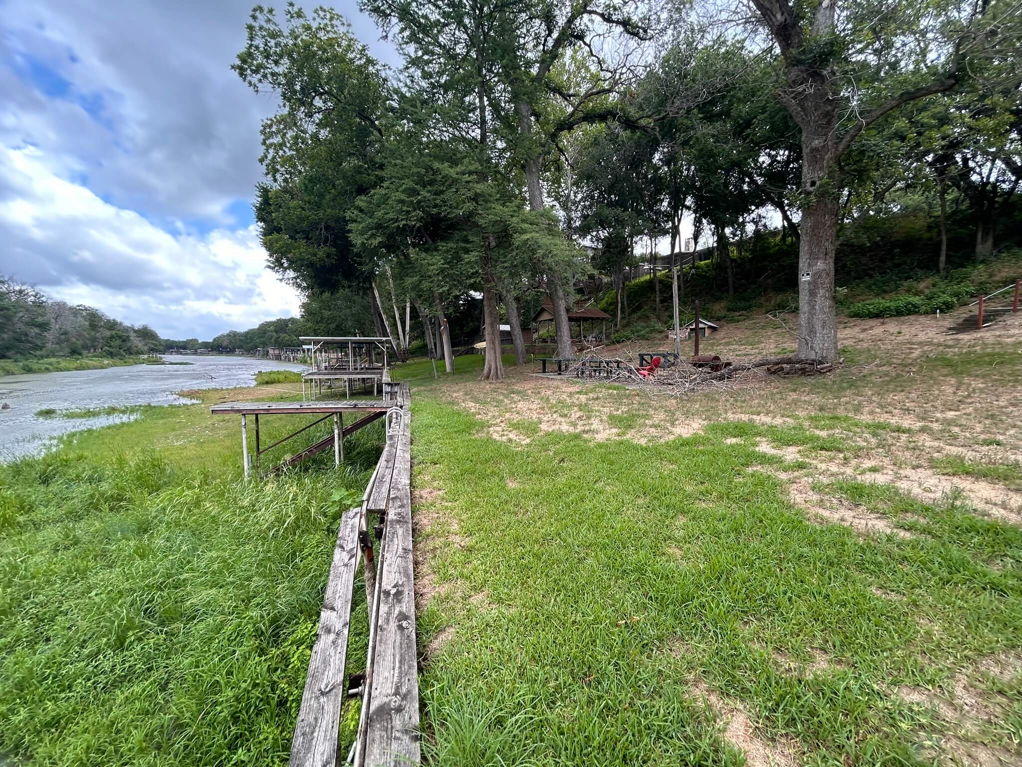 Before &mdash; failing wood dock on rail piling and aging wood bulkhead system on the south side of Lake McQueeney